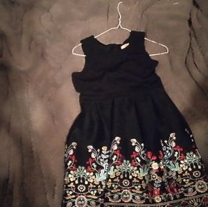 Black short dress with floral embroidered at the bottom